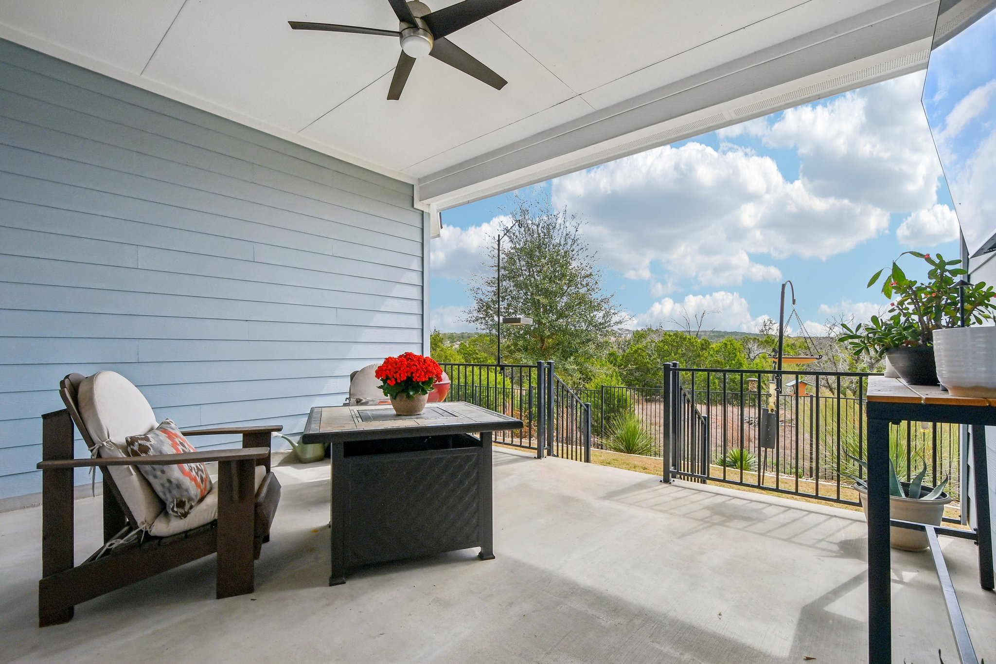 520 Hazy Hills Loop Dripping Springs, TX 78620 - Photo 9 of 27 Step outside to the covered back patio to take full advantage of this property's rare lot placement. Enjoy uninterrupted, quiet views of the surrounding green spaces right from your own backyard