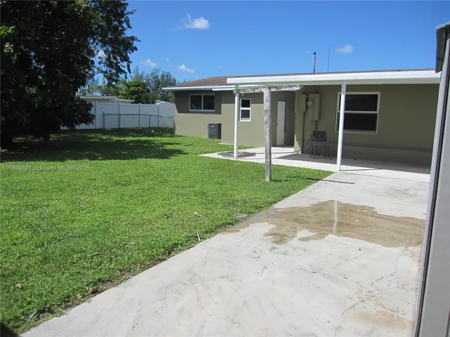 a view of a backyard with a garden and plants