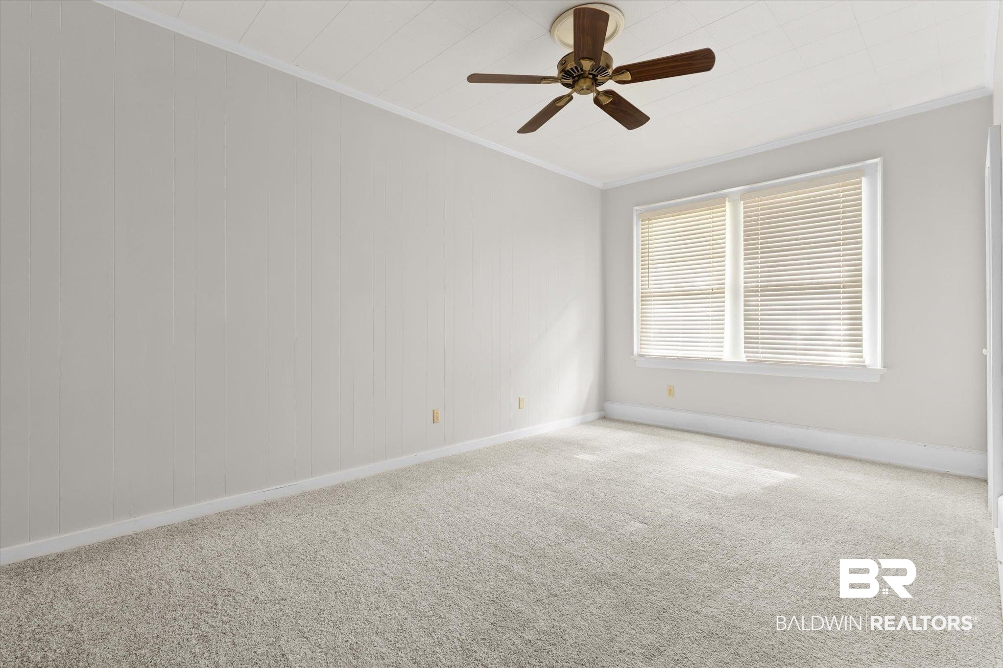 211 3rd Street Mobile, AL 36611 - Photo 9 of 20 Spare room with ornamental molding, ceiling fan, and carpet flooring