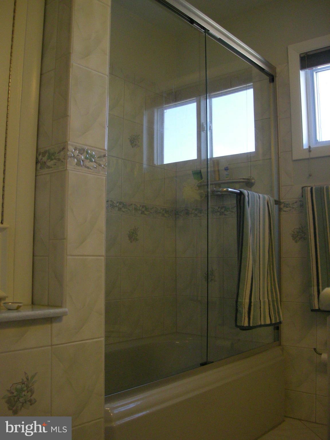 3209 Nerak Road Baltimore, MD 21208 - Photo 5 of 15 a bathroom with a shower and a tub