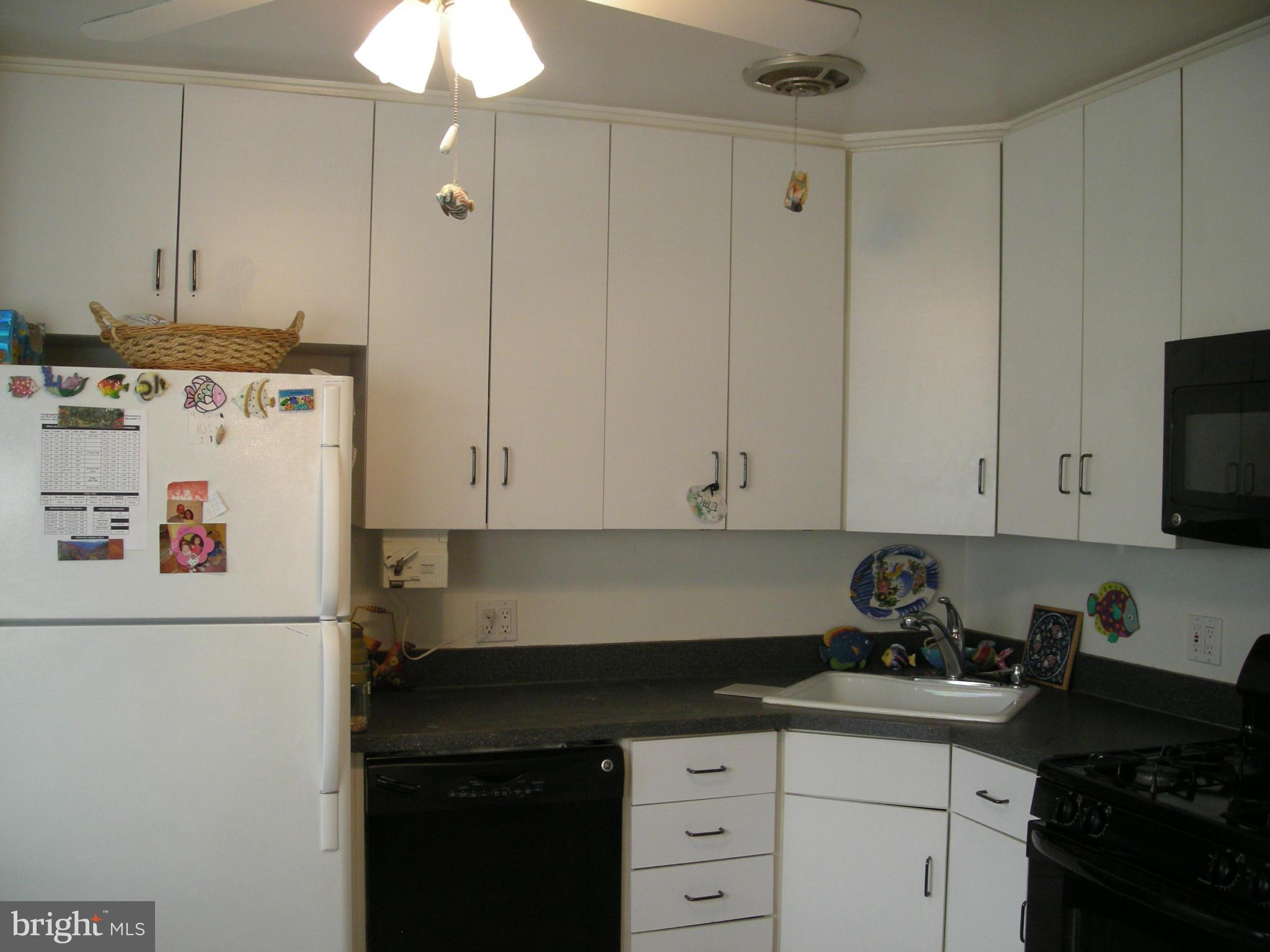 3209 Nerak Road Baltimore, MD 21208 - Photo 7 of 15 a kitchen with cabinets appliances and a sink