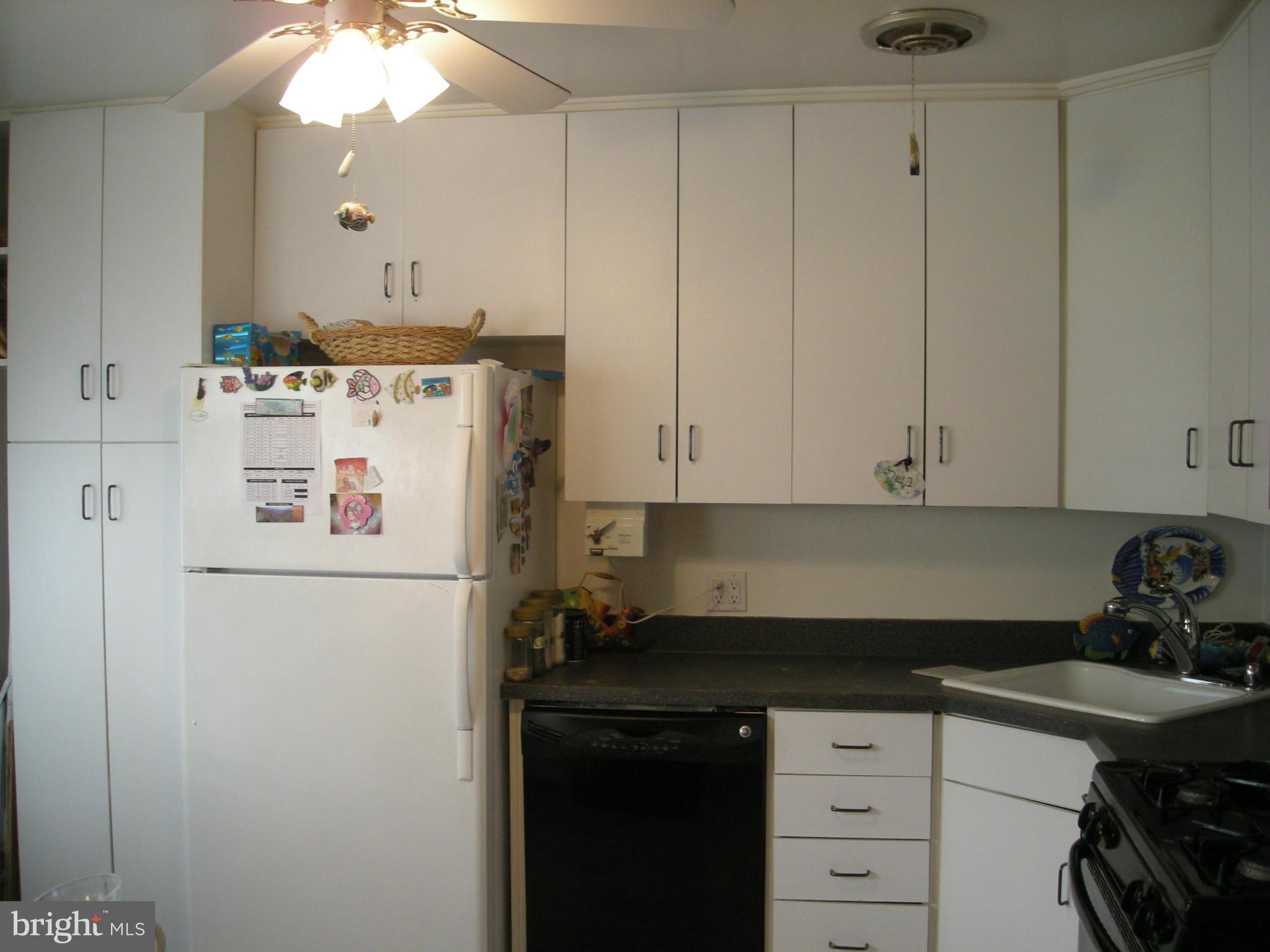 3209 Nerak Road Baltimore, MD 21208 - Photo 9 of 15 a kitchen with a refrigerator and cabinets