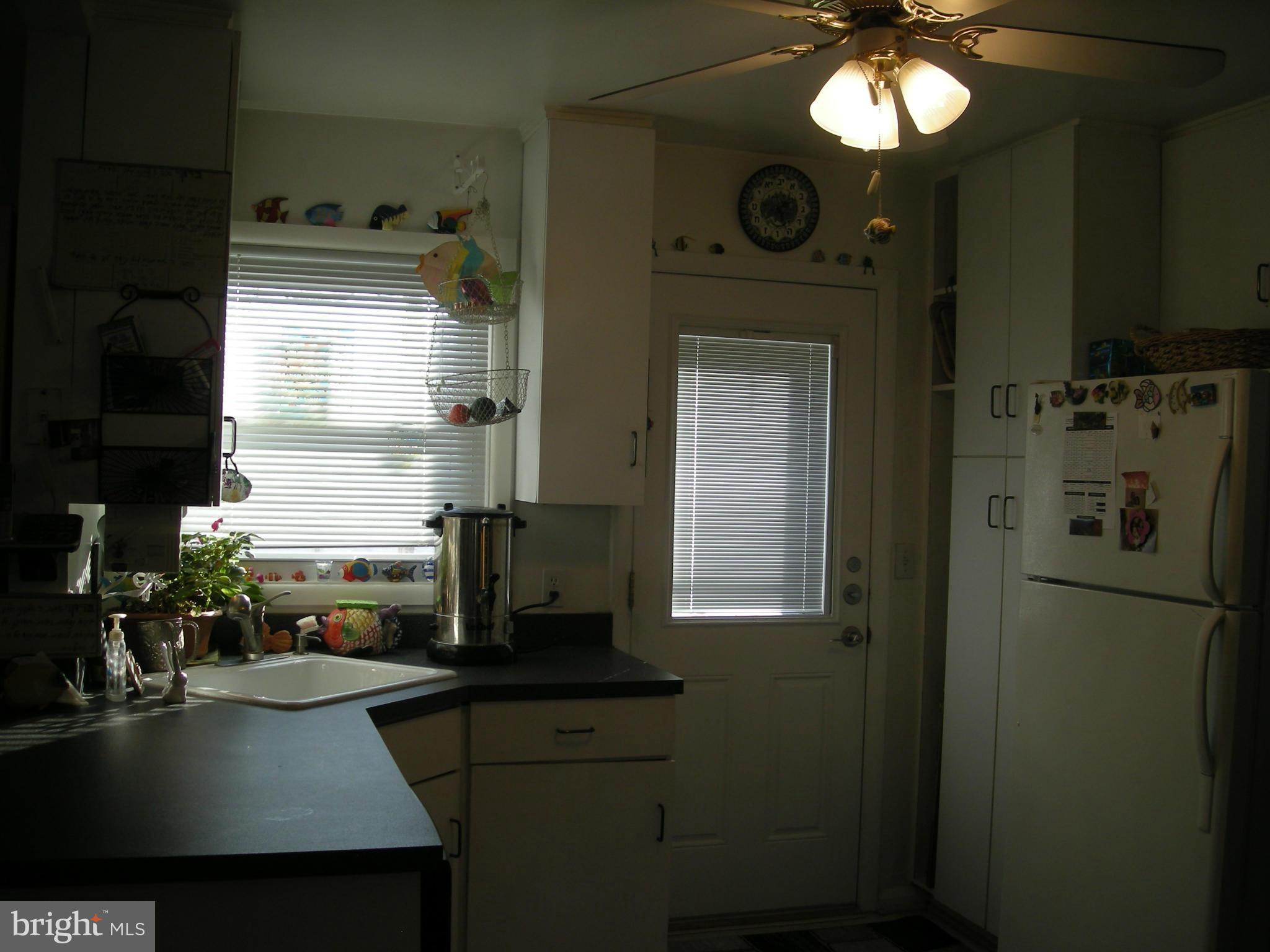 3209 Nerak Road Baltimore, MD 21208 - Photo 10 of 15 a kitchen with a refrigerator a stove and cabinets