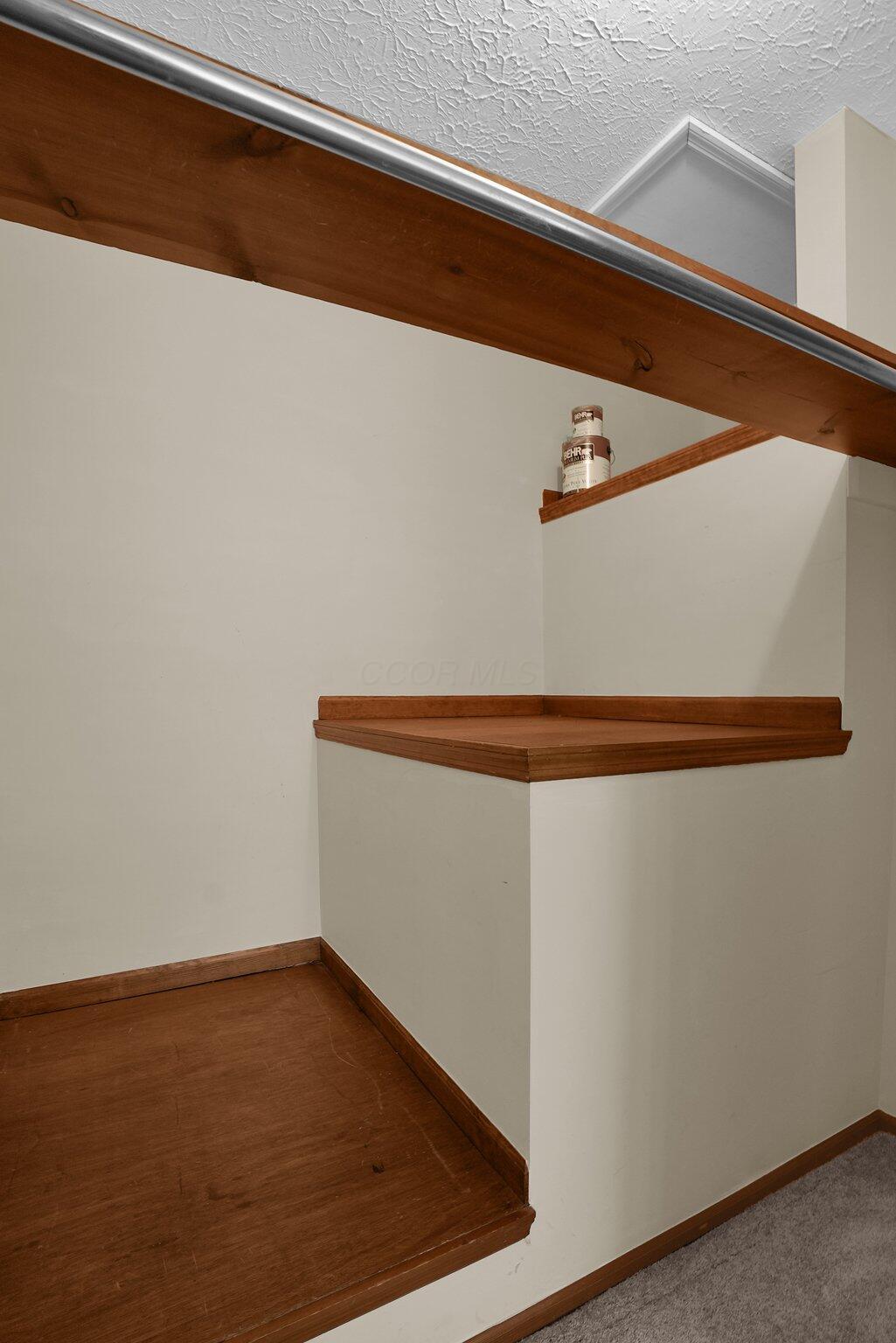 623 Rockbridge Road Westerville, OH 43081 - Photo 40 of 63 Bedroom #4 has standard closet hanging with additional depth for storage above the staircase and attic access door.