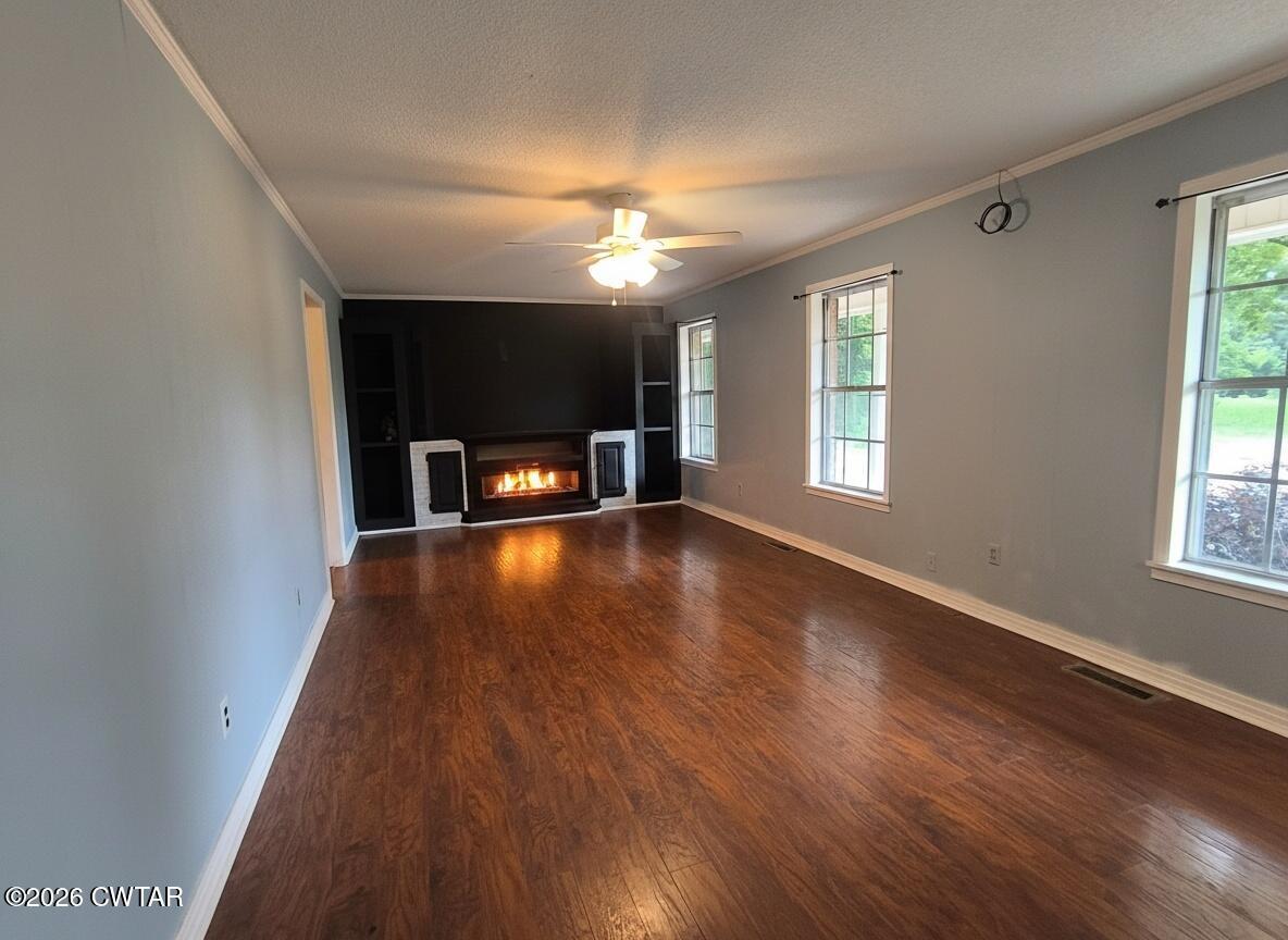 513 Viar Road Dyersburg, TN 38024 - Photo 7 of 37 wooden floor in an empty room with a window