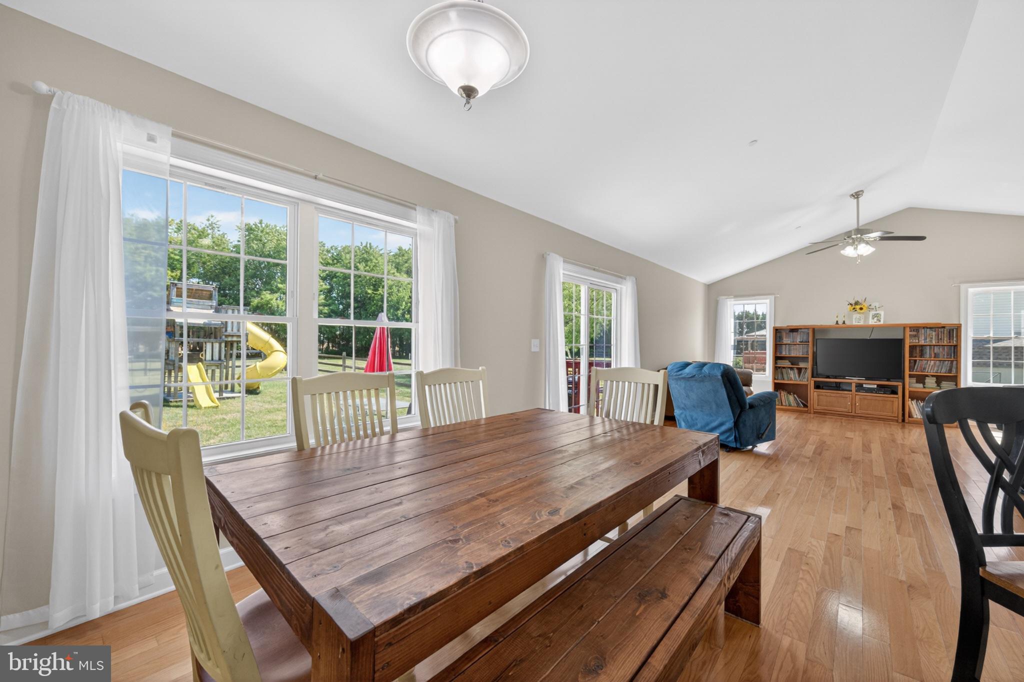 23283 Magnolia Hills Road Denton, MD 21629 - Photo 13 of 54 a view of a dining room with furniture window and wooden floor