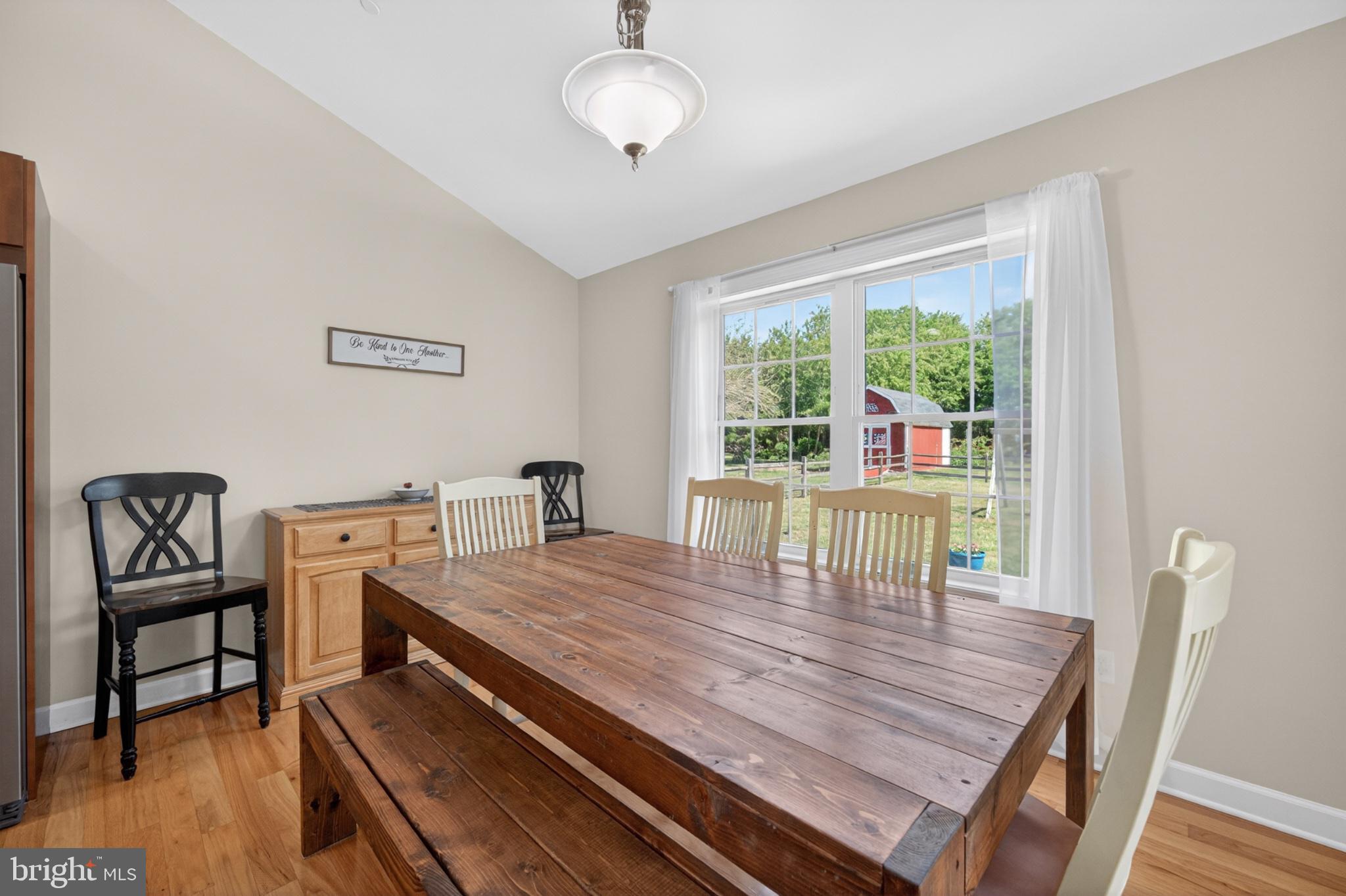 23283 Magnolia Hills Road Denton, MD 21629 - Photo 16 of 54 a dining room with wooden floor and breakfast area