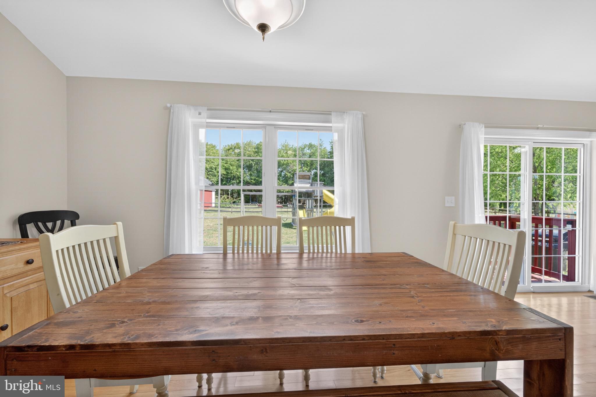 23283 Magnolia Hills Road Denton, MD 21629 - Photo 17 of 54 a dining room with wooden floor