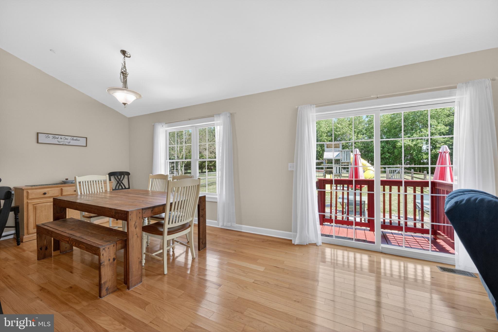 23283 Magnolia Hills Road Denton, MD 21629 - Photo 18 of 54 a view of a dining room with furniture window and wooden floor