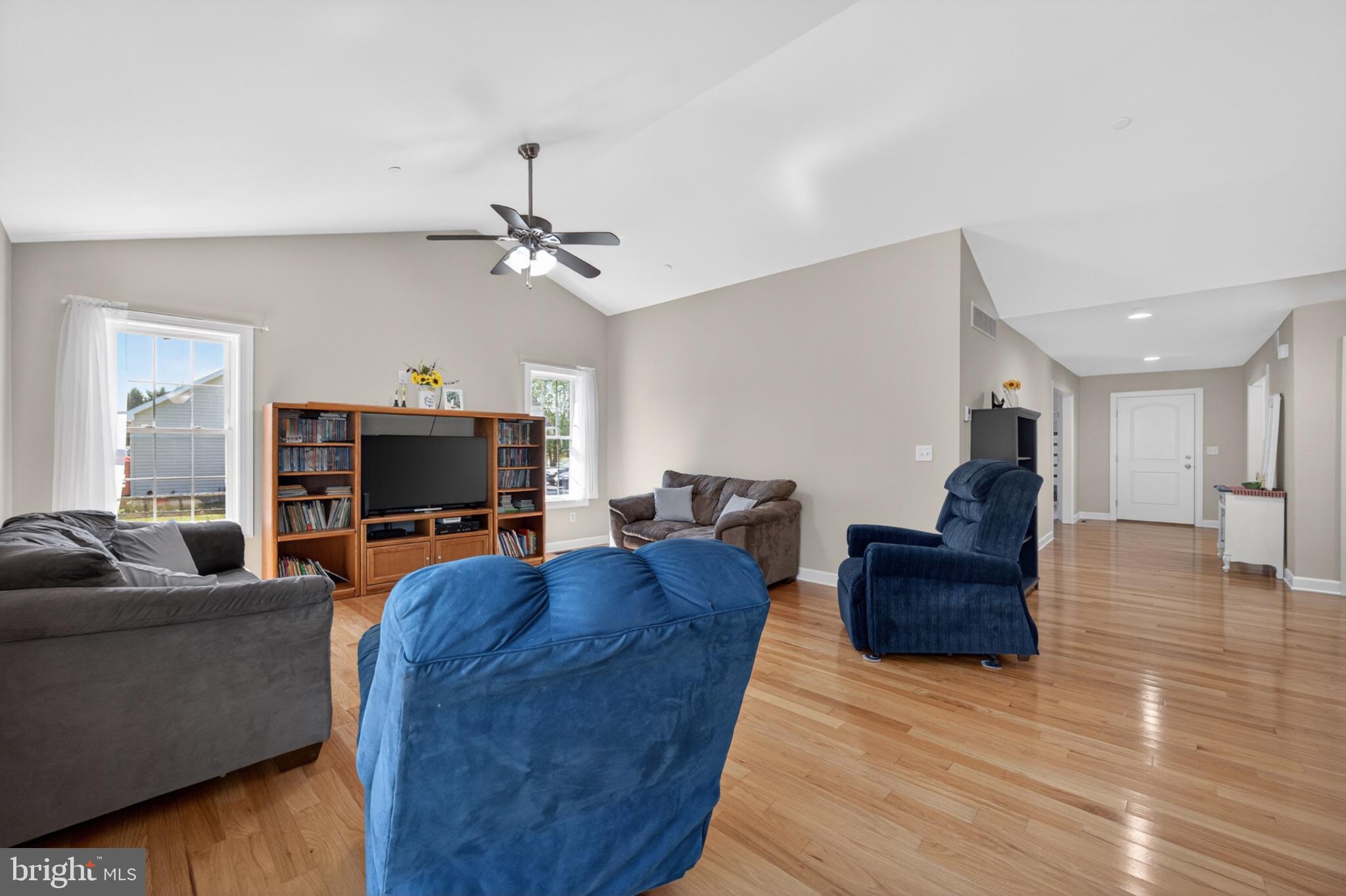 23283 Magnolia Hills Road Denton, MD 21629 - Photo 21 of 54 a living room with furniture and a flat screen tv