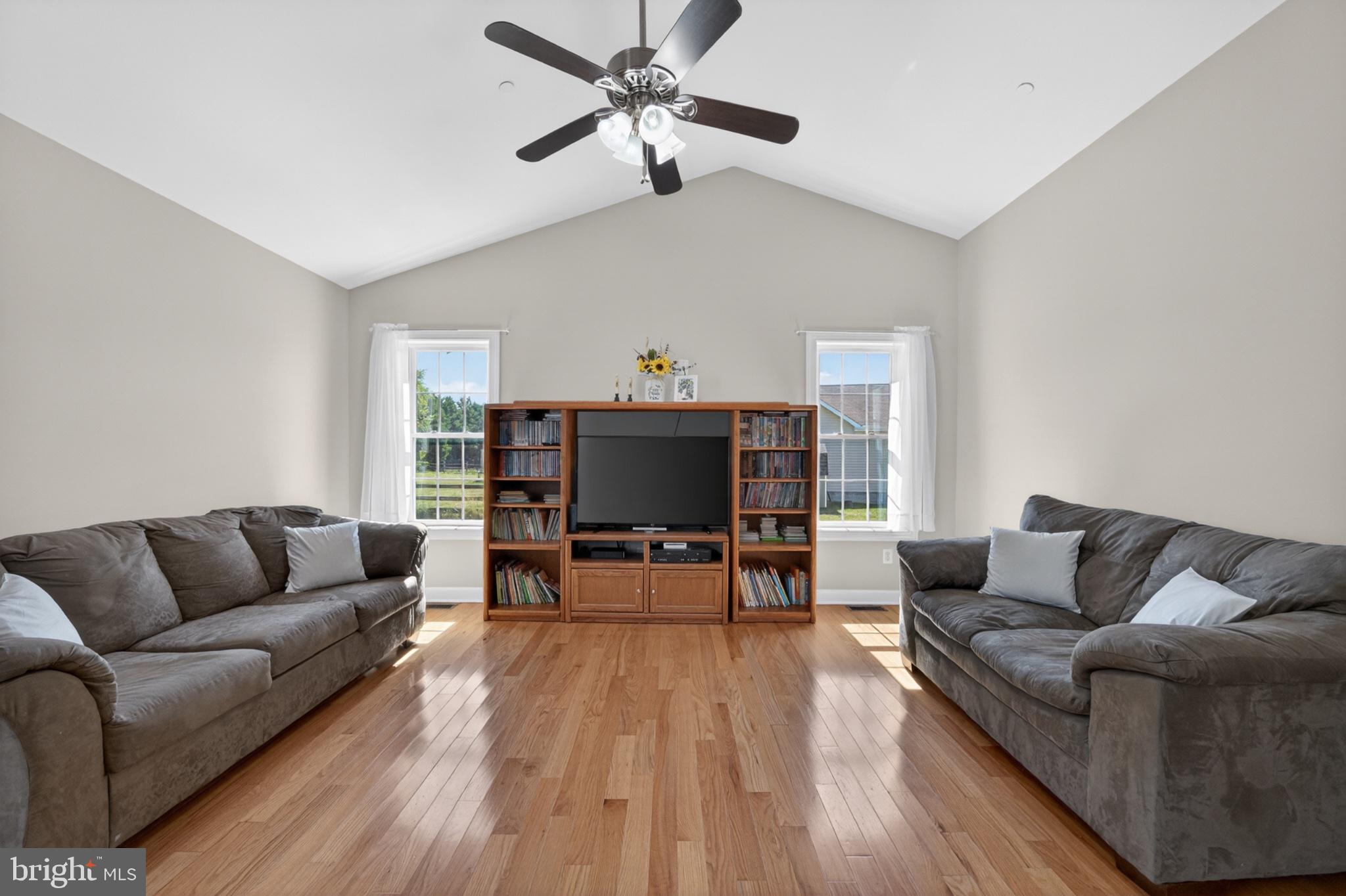 23283 Magnolia Hills Road Denton, MD 21629 - Photo 22 of 54 a living room with furniture and a flat screen tv