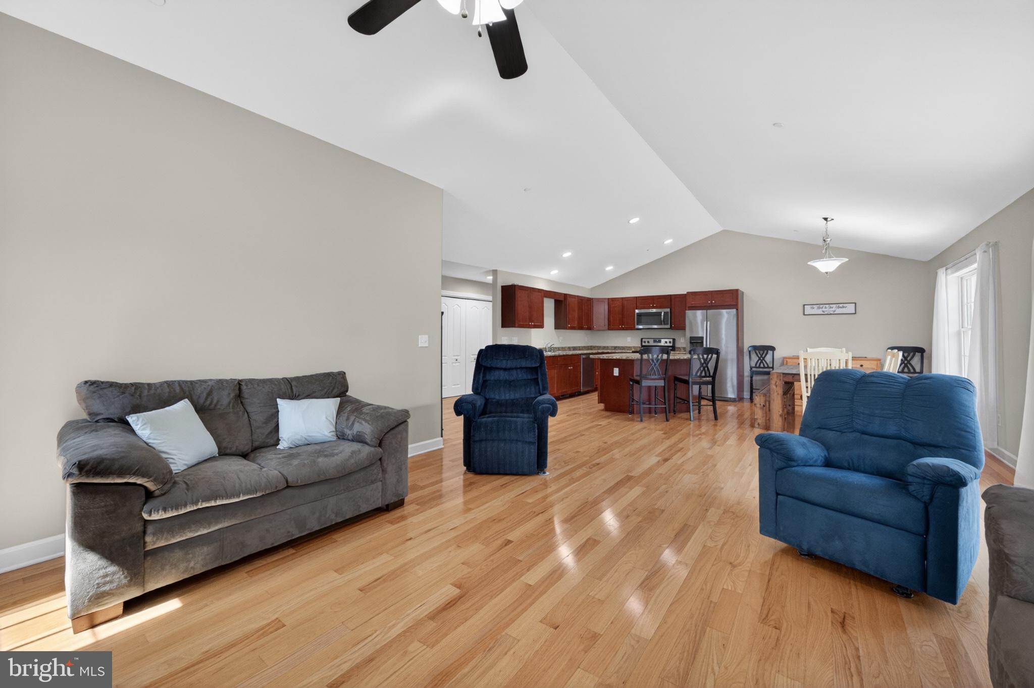 23283 Magnolia Hills Road Denton, MD 21629 - Photo 23 of 54 a living room with furniture and wooden floor
