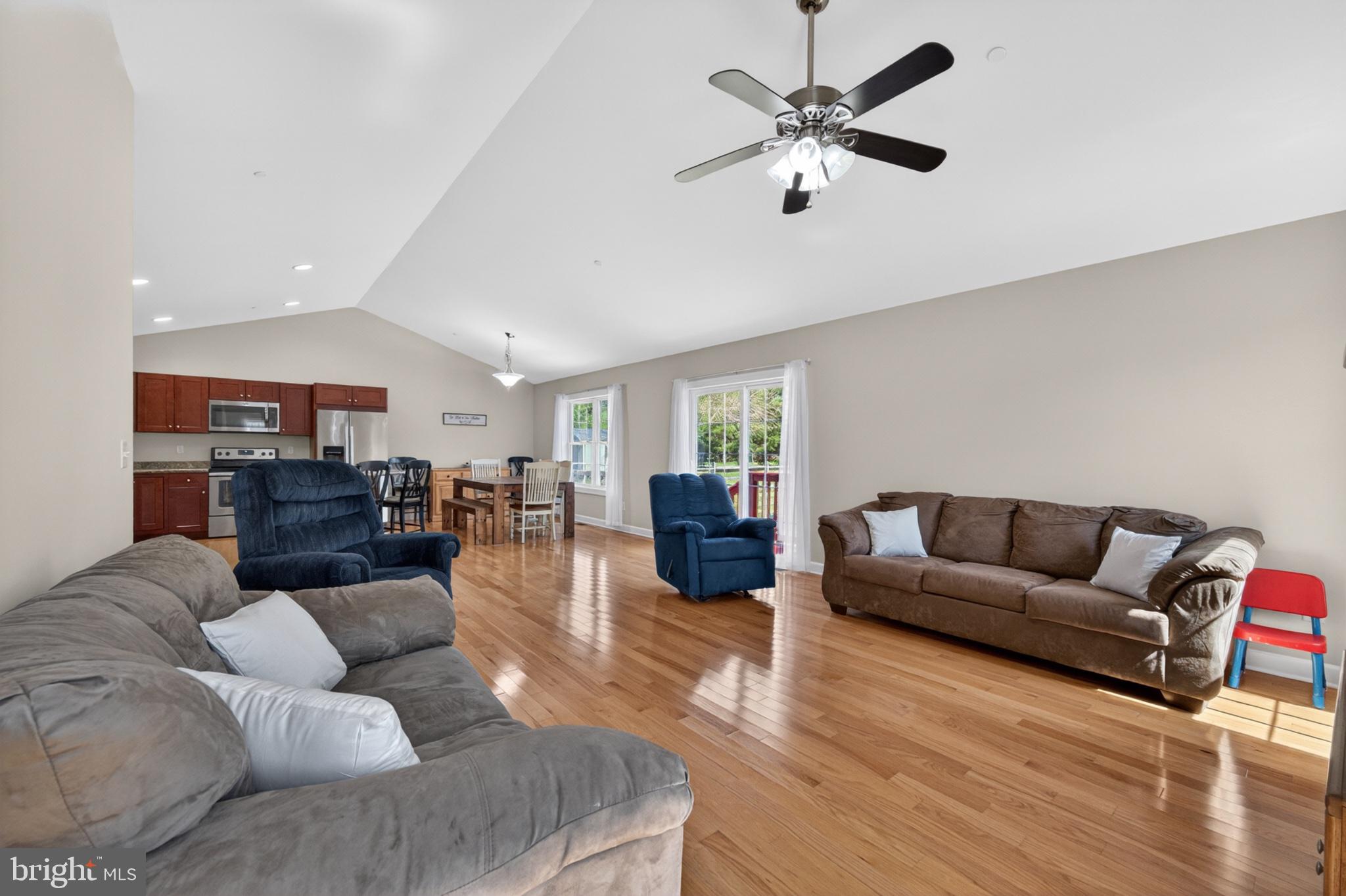 23283 Magnolia Hills Road Denton, MD 21629 - Photo 24 of 54 a living room with furniture and wooden floor