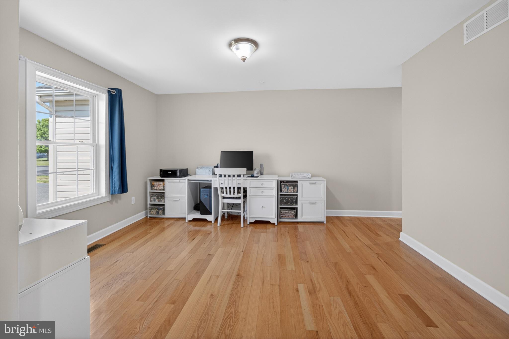 23283 Magnolia Hills Road Denton, MD 21629 - Photo 26 of 54 a room with furniture and a wooden floor