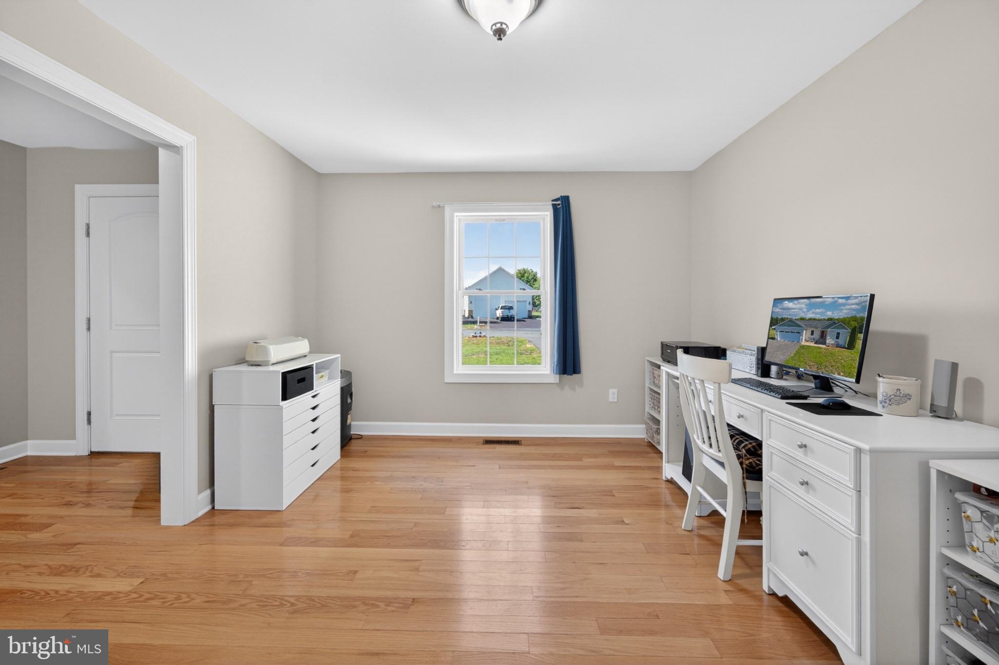 23283 Magnolia Hills Road Denton, MD 21629 - Photo 28 of 54 a view of a workspace with furniture and a window