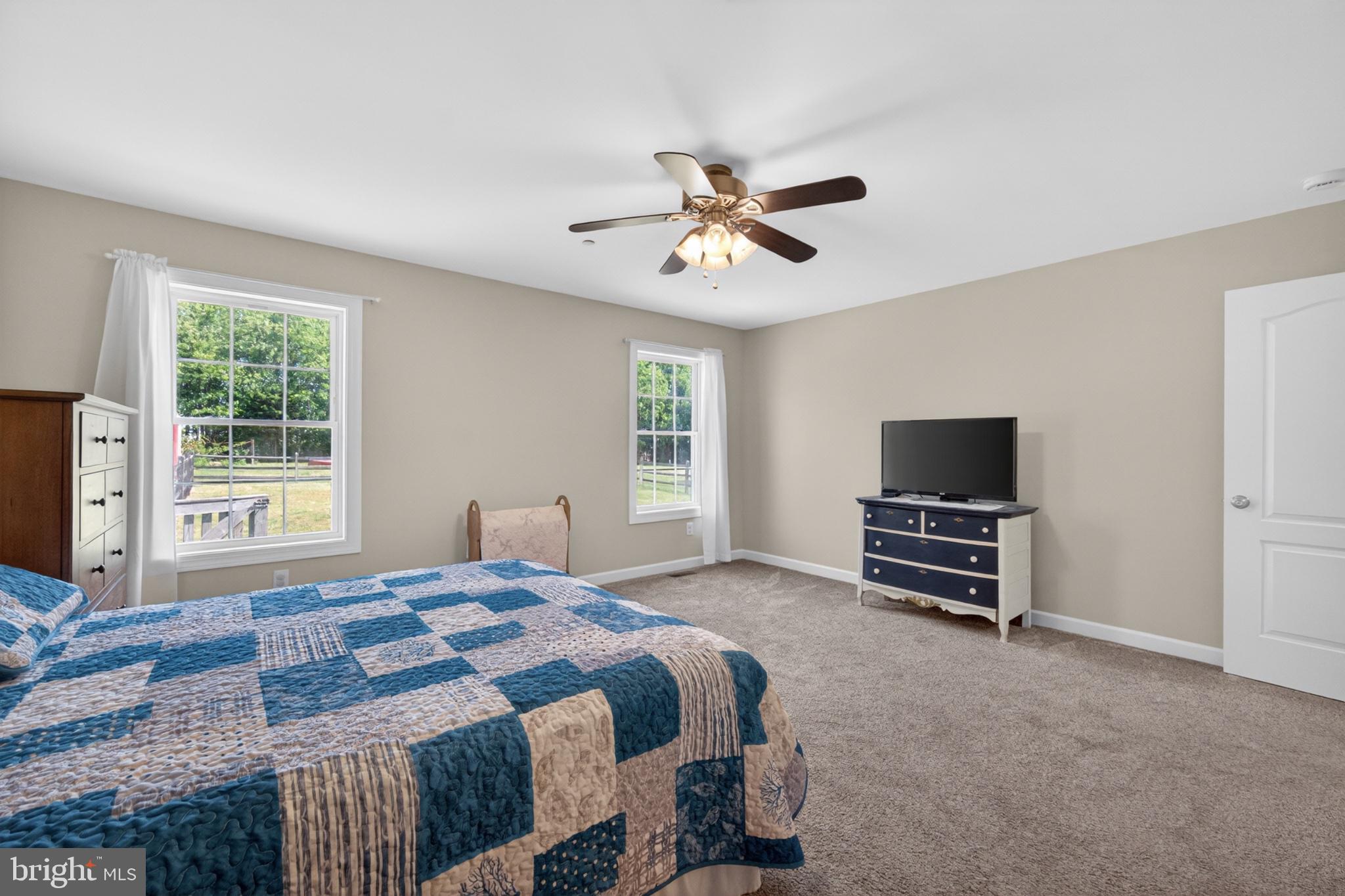 23283 Magnolia Hills Road Denton, MD 21629 - Photo 32 of 54 a bedroom with a bed and a television