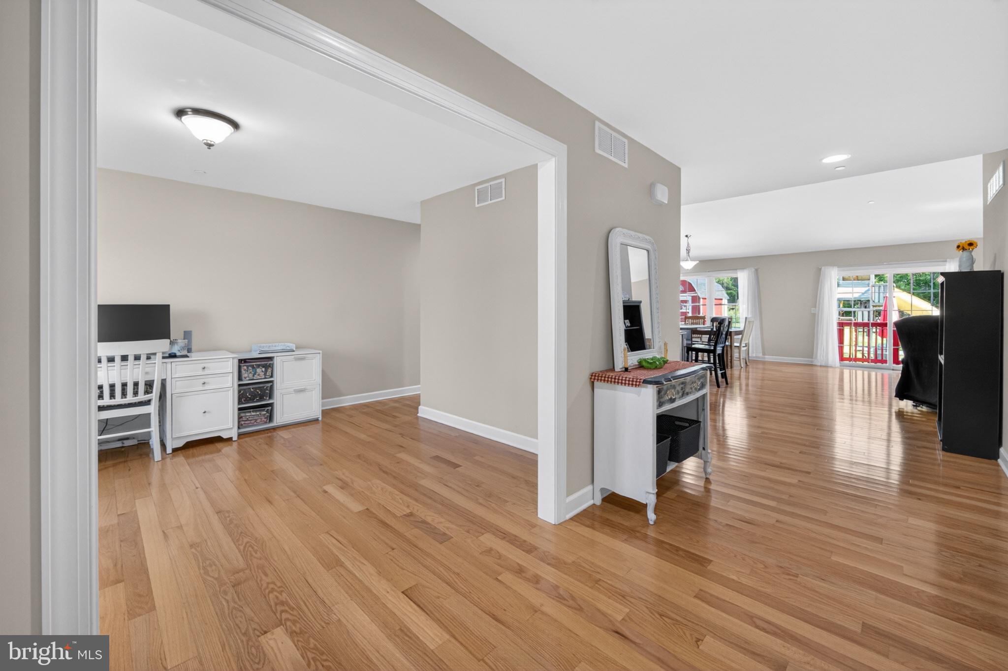 23283 Magnolia Hills Road Denton, MD 21629 - Photo 6 of 54 a view of a living room kitchen and a wooden floor