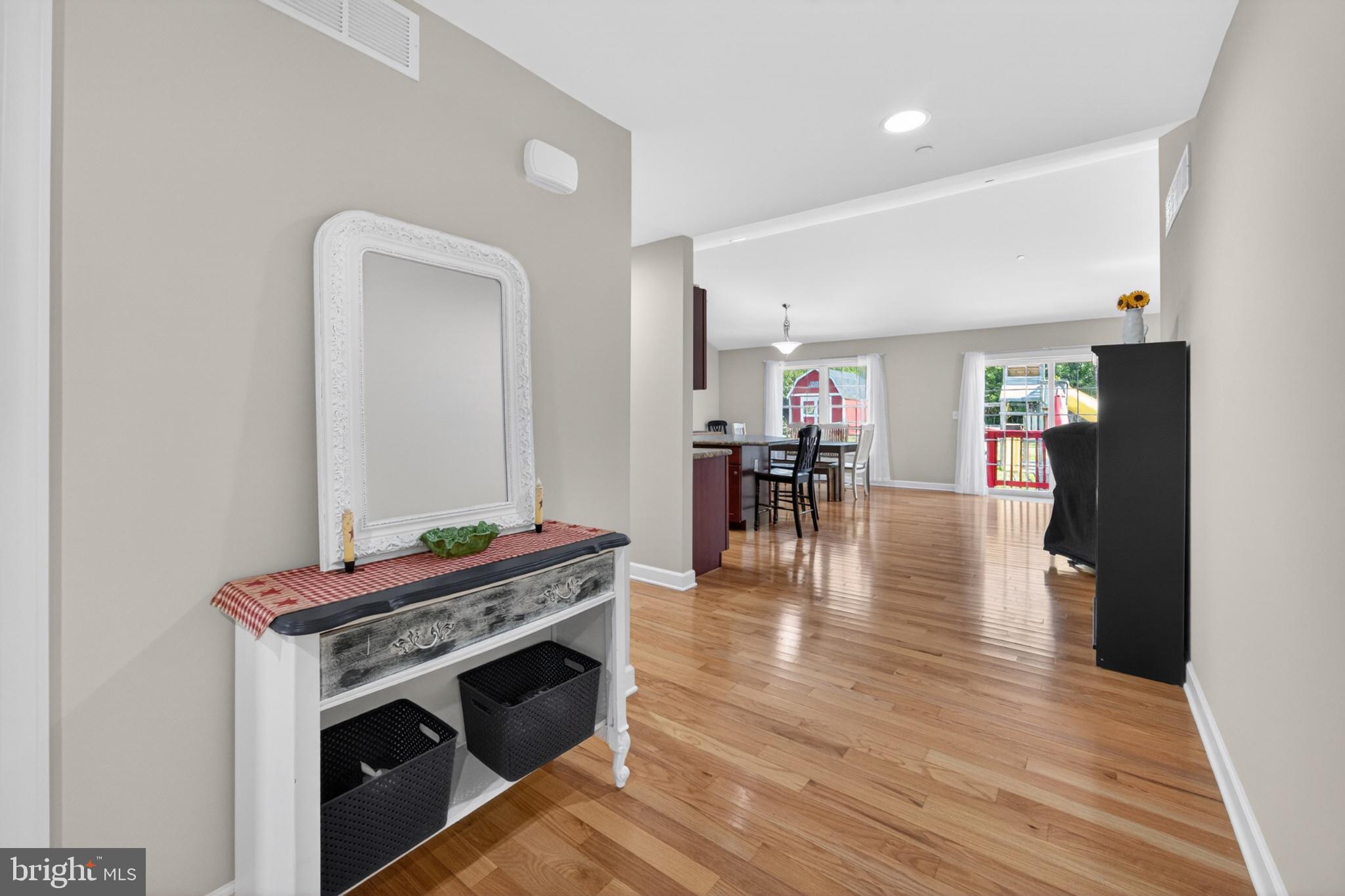 23283 Magnolia Hills Road Denton, MD 21629 - Photo 8 of 54 a view of a kitchen with furniture and wooden floor