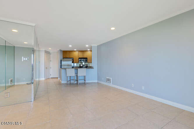 2901 Peninsula Road, Unit 348 Oxnard, CA 93035 - Photo 11 of 22 an empty room with a kitchen and a sink