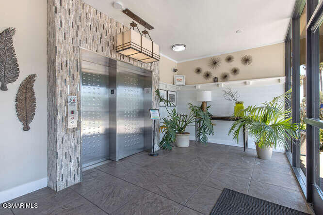 2901 Peninsula Road, Unit 348 Oxnard, CA 93035 - Photo 5 of 22 a potted plant in front of a door