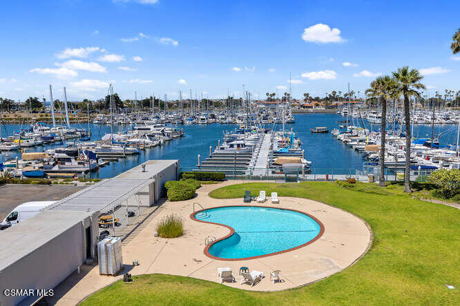 2901 Peninsula Road, Unit 348 Oxnard, CA 93035 - Photo 7 of 22 a swimming pool with outdoor seating and yard