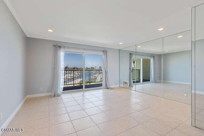 2901 Peninsula Road, Unit 348 Oxnard, CA 93035 - Photo 9 of 22 a view of an empty room with kitchen and window