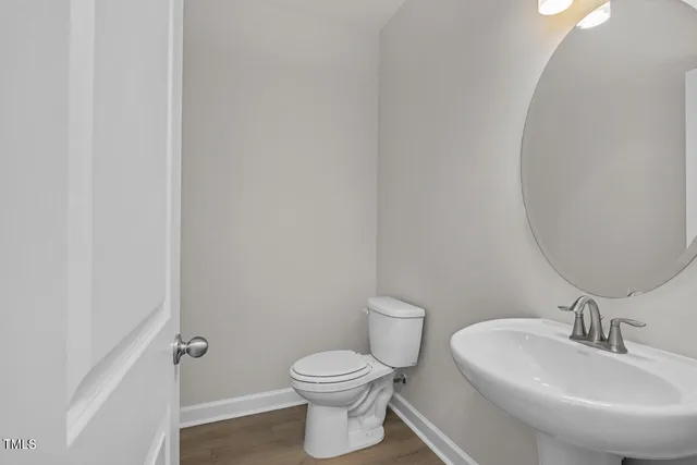 an empty room with closet and fan