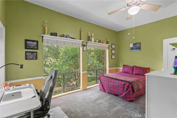 a bed room with a bed and a window