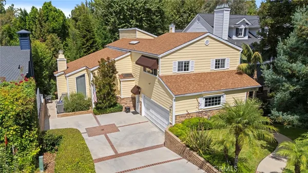a aerial view of a house with a yard
