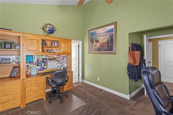 a view of a workspace with furniture