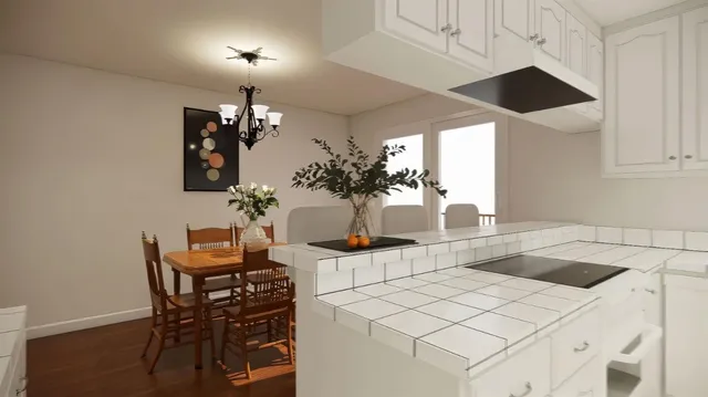 a kitchen with a table and chairs in it