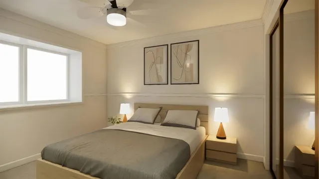 a bedroom with a bed and a window