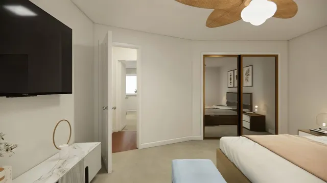 a bedroom with a bed and a flat screen tv