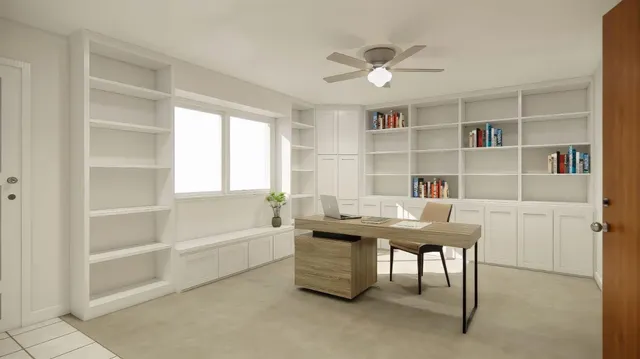 a view of a workspace with furniture and a window