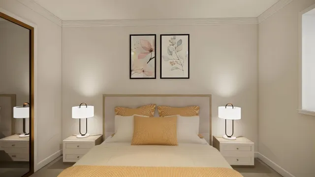 a bedroom with a bed and a lamp
