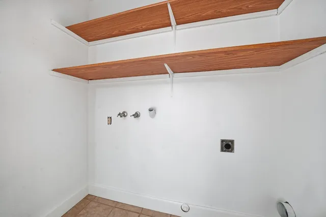 a view of an empty room with a fan