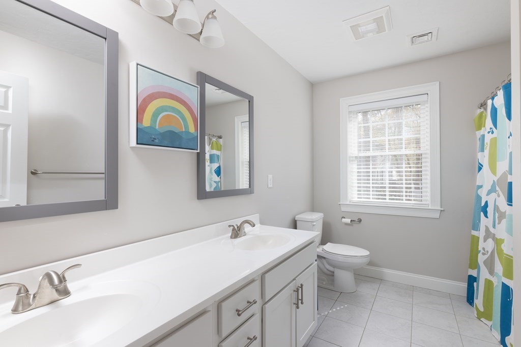 1 Pine House Road Millis, MA 02054 - Photo 18 of 33 a bathroom with a sink and a mirror