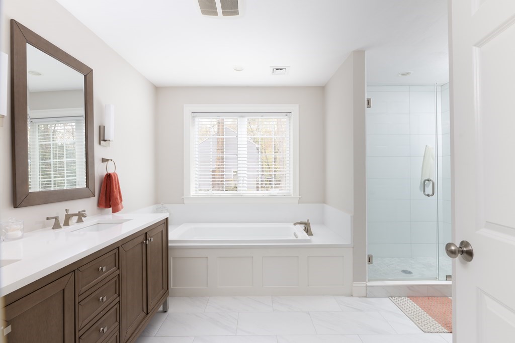 1 Pine House Road Millis, MA 02054 - Photo 20 of 33 a bathroom with a tub sink and mirror