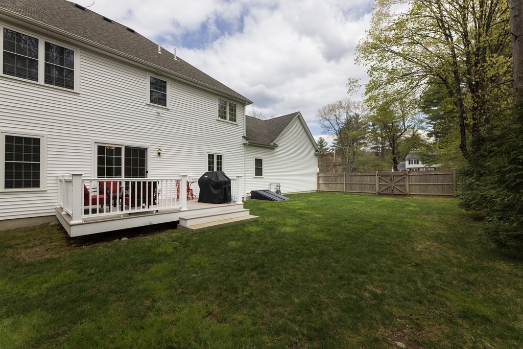 1 Pine House Road Millis, MA 02054 - Photo 29 of 33 a view of a house with a backyard and deck