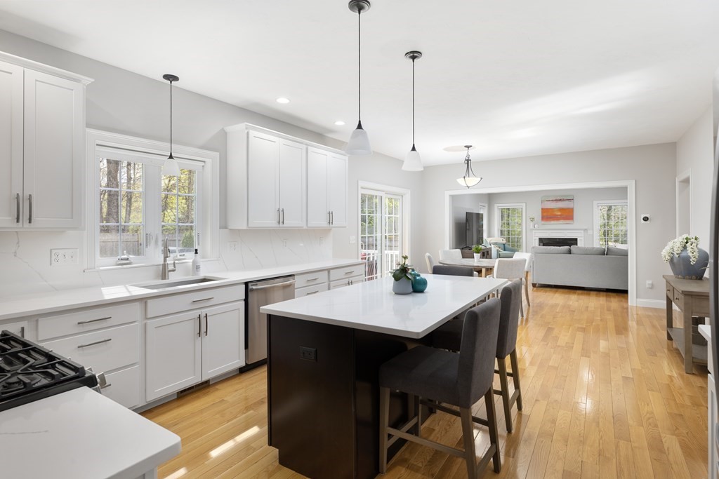 1 Pine House Road Millis, MA 02054 - Photo 3 of 33 a kitchen with a table chairs sink and cabinets