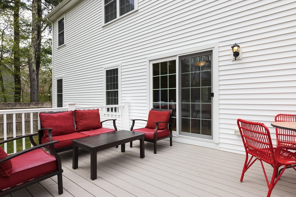 1 Pine House Road Millis, MA 02054 - Photo 31 of 33 a blue bench sitting in front of a white house