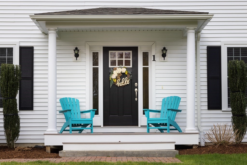1 Pine House Road Millis, MA 02054 - Photo 33 of 33 a front view of a house with potted plants