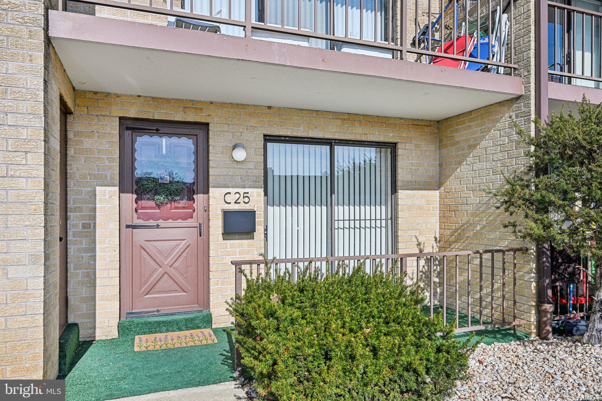 9906 Bustleton Avenue, Unit C25 Philadelphia, PA 19115 - Photo 1 of 26 a front view of a house with a yard and plants