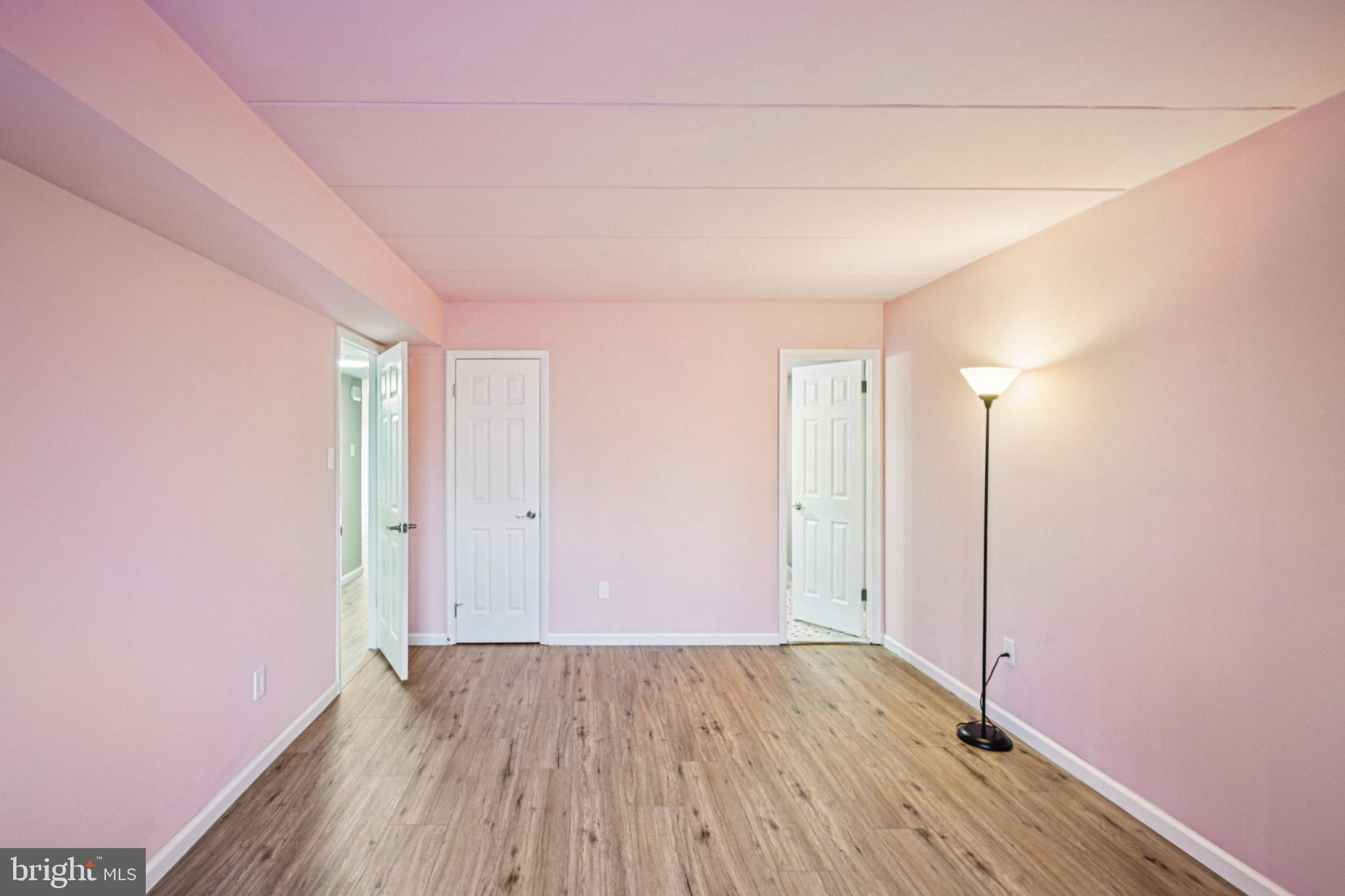 9906 Bustleton Avenue, Unit C25 Philadelphia, PA 19115 - Photo 16 of 26 a view of an empty room with wooden floor