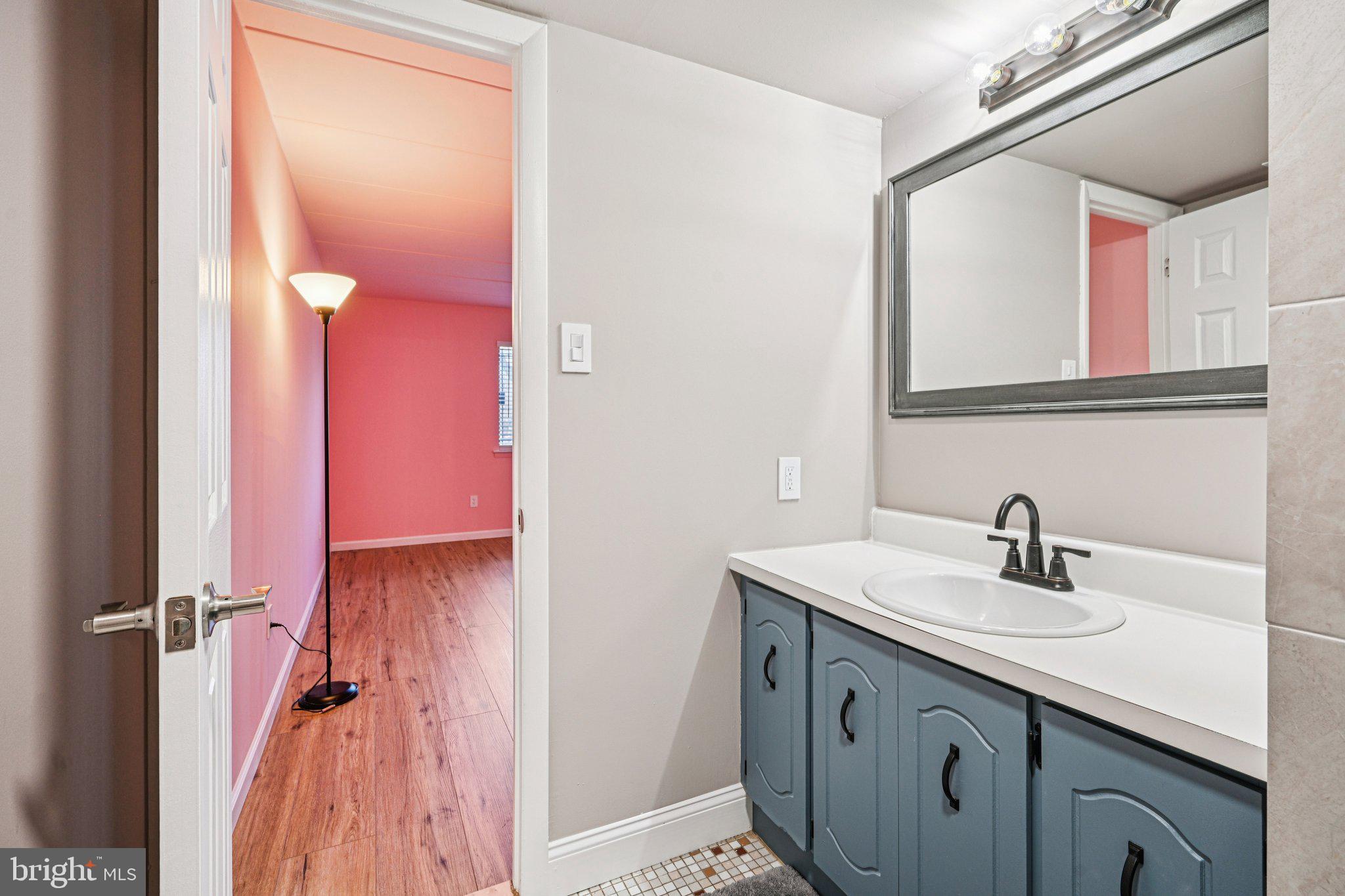 9906 Bustleton Avenue, Unit C25 Philadelphia, PA 19115 - Photo 17 of 26 a bathroom with a sink and a mirror