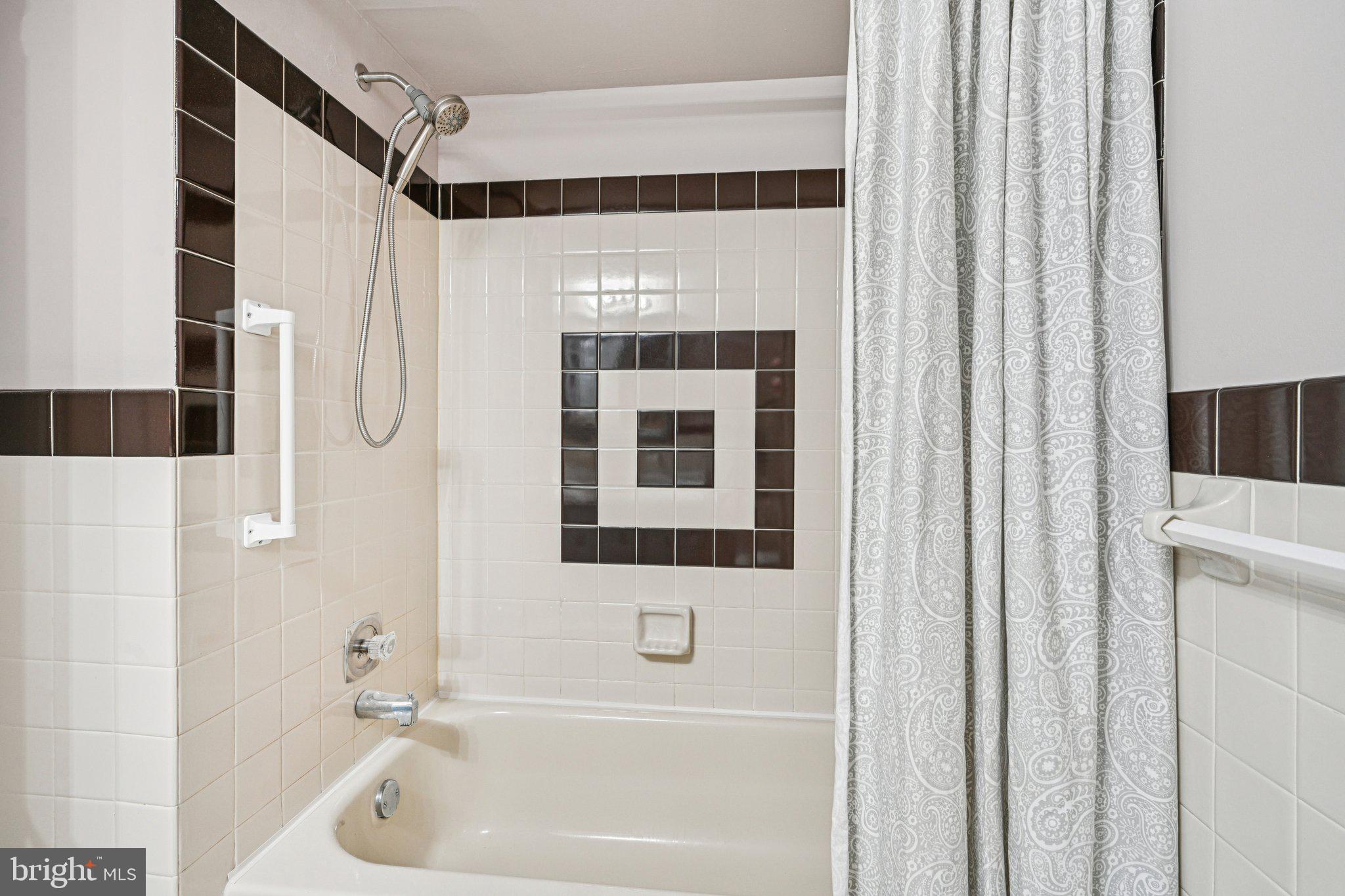 9906 Bustleton Avenue, Unit C25 Philadelphia, PA 19115 - Photo 23 of 26 a bathroom with a sink a window and a shower