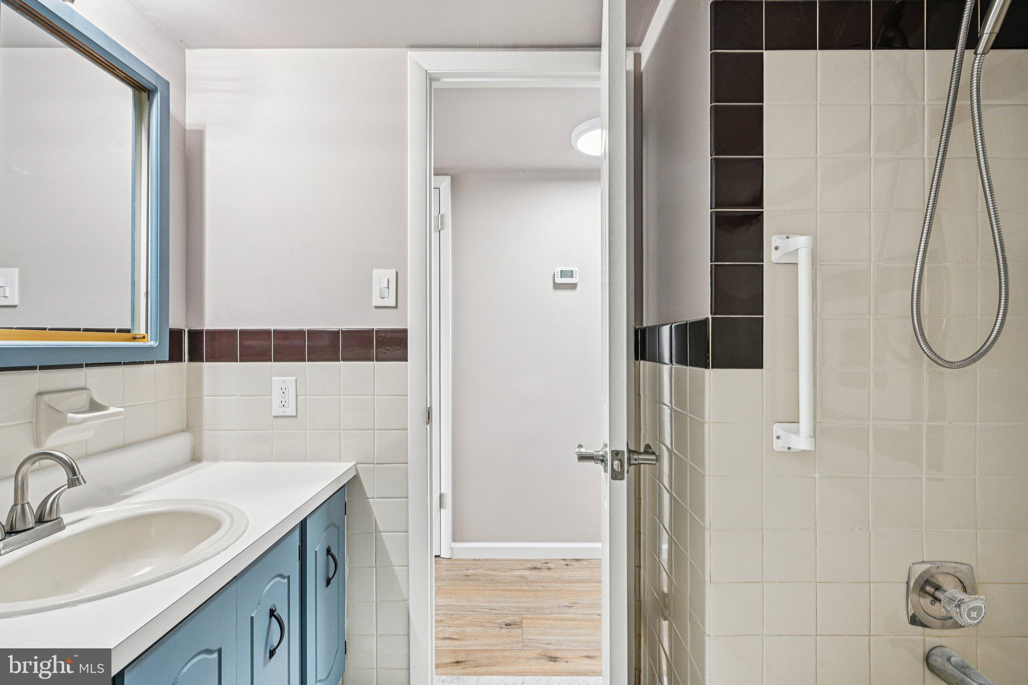 9906 Bustleton Avenue, Unit C25 Philadelphia, PA 19115 - Photo 24 of 26 a bathroom with a sink and a mirror