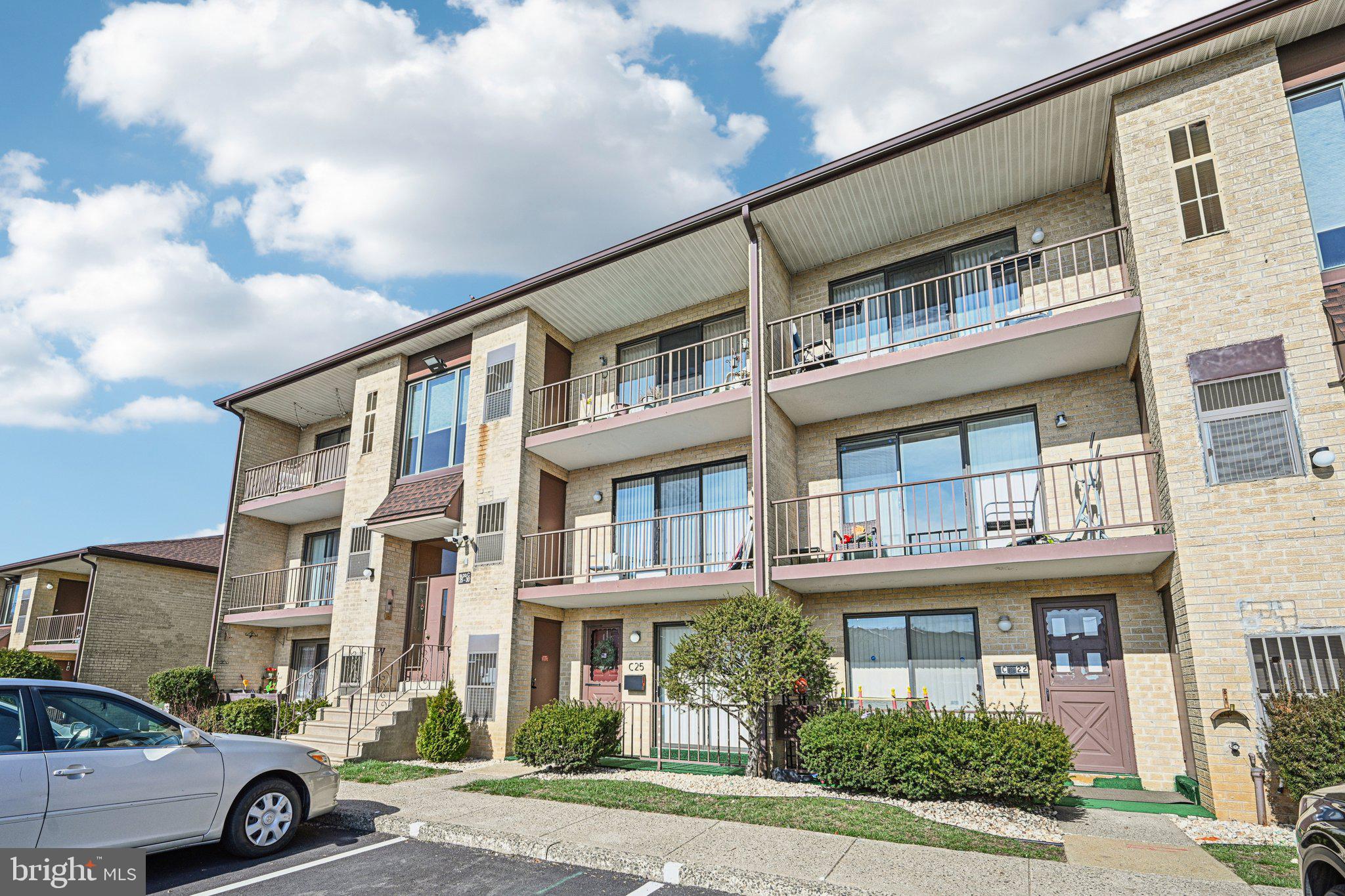 9906 Bustleton Avenue, Unit C25 Philadelphia, PA 19115 - Photo 3 of 26 a car parked in front of a building