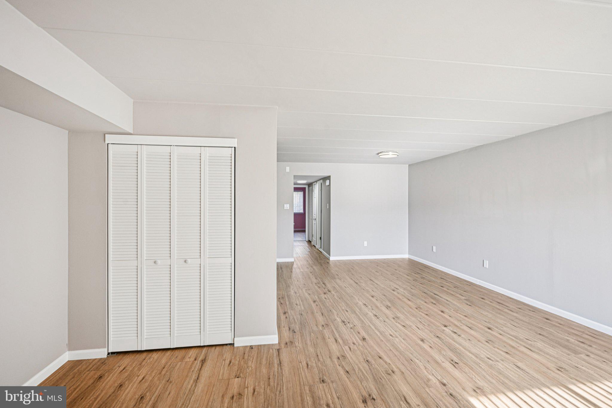 9906 Bustleton Avenue, Unit C25 Philadelphia, PA 19115 - Photo 5 of 26 a view of an empty room with wooden floor