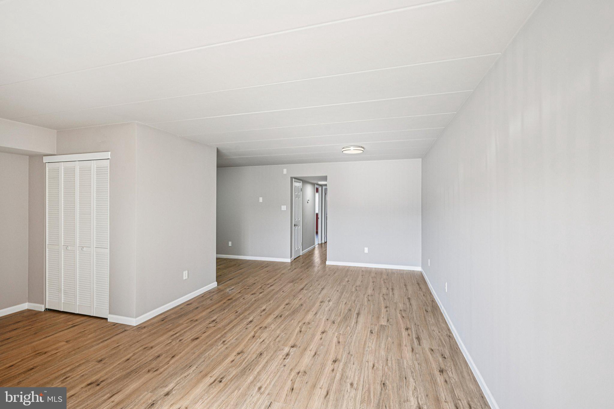 9906 Bustleton Avenue, Unit C25 Philadelphia, PA 19115 - Photo 7 of 26 a view of an empty room with wooden floor